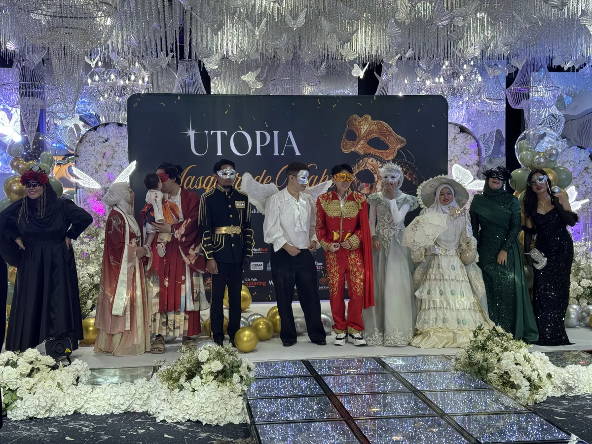 Utopia Masquerade Night — full team on stage in costume