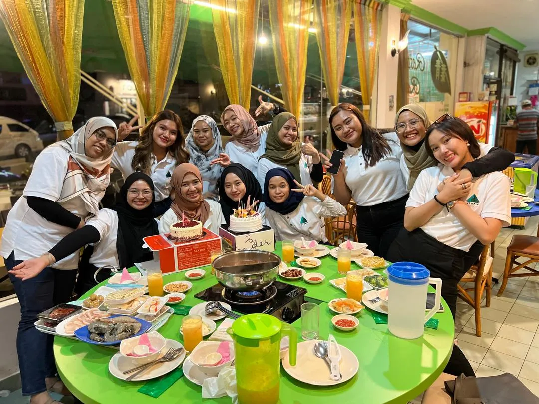 Team birthday celebration with cake