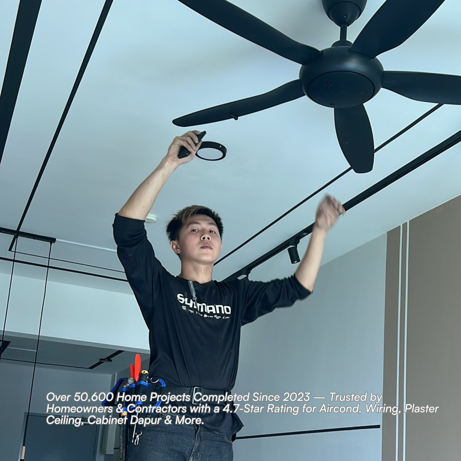 Technician installing fan