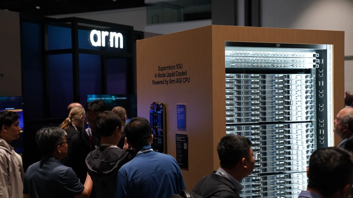 A crowd gathers at the Arm booth in front of a Supermicro 10U 4-node liquid-cooled server rack powered by Arm AGI CPU