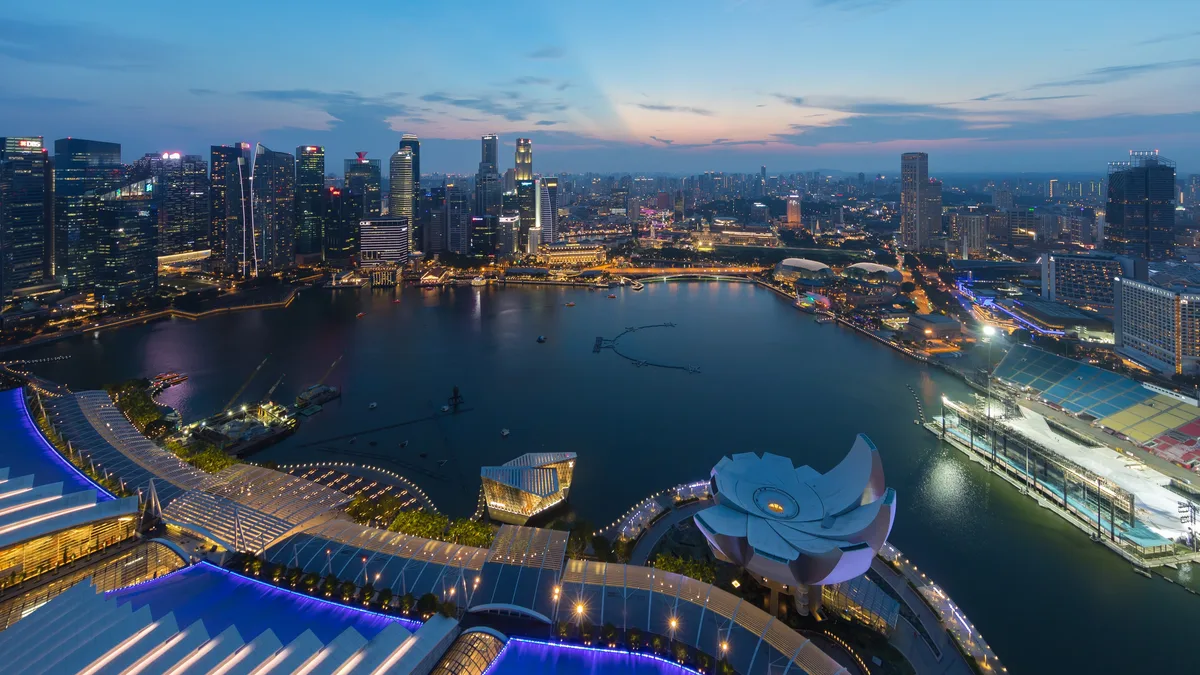Singapore’s central business district skyline at dusk, seen from the Marina Bay Sands observation deck.