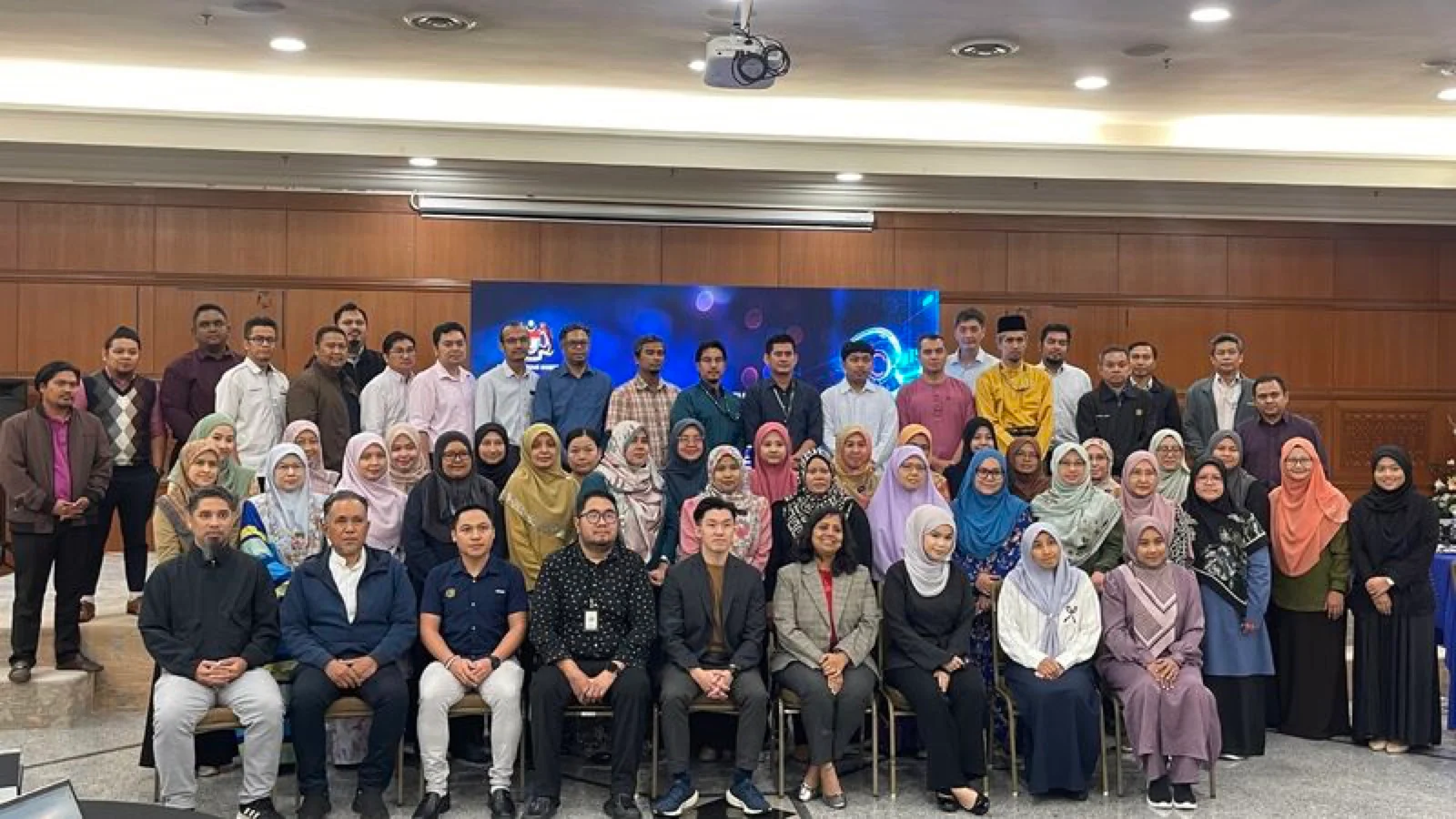 Malaysian public officers and trainers gather for a group photograph during the AI At Work 2.0 Train-the-Trainer programme