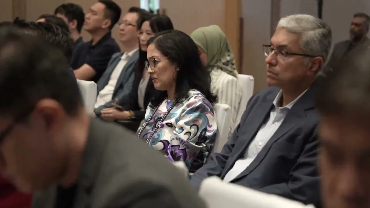 Malaysian and international contributors listen during a National AI Office working-group session