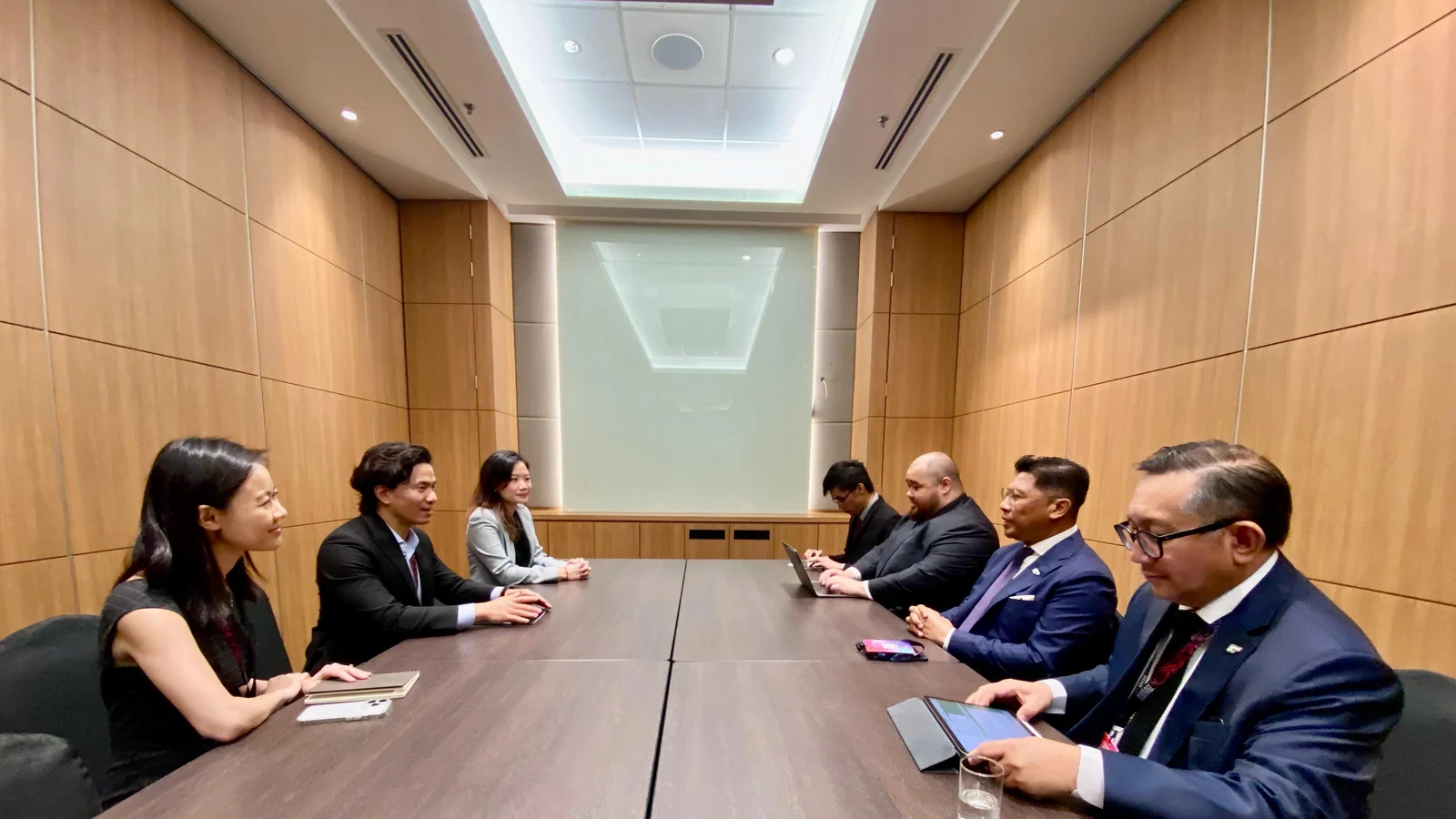 Delegates meet around a conference table alongside the ASEAN AI Malaysia Summit