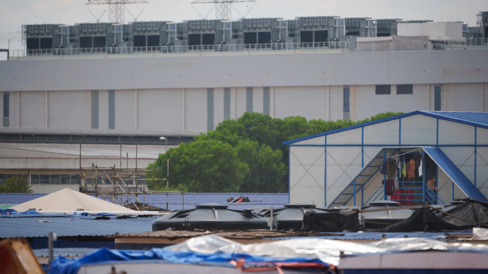 Construction-worker lodging stands in front of a data centre in Sedenak Tech Park in Johor