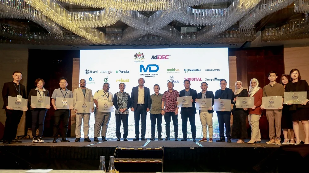 Digital Minister Gobind Singh Deo and Malaysian AI providers at the Malaysia Digital Tech Adoption Summit in Kuala Lumpur