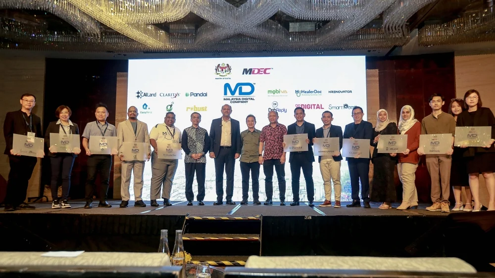 Digital Minister Gobind Singh Deo with Malaysian AI companies at MDEC's September 2024 AI Tech Adoption Summit
