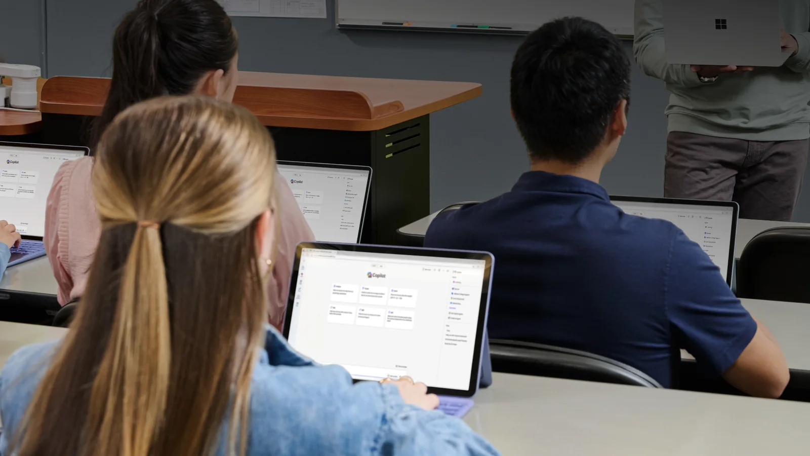 Learners use Microsoft Copilot on laptops during a classroom session
