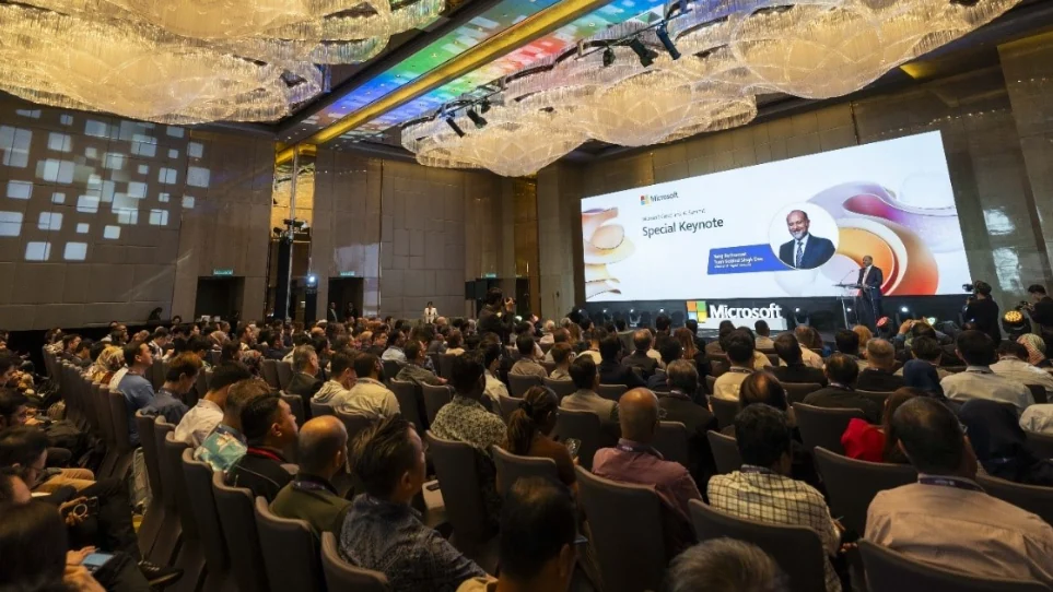 Malaysian business attendees listen to a keynote at the Microsoft Cloud and AI Summit Malaysia