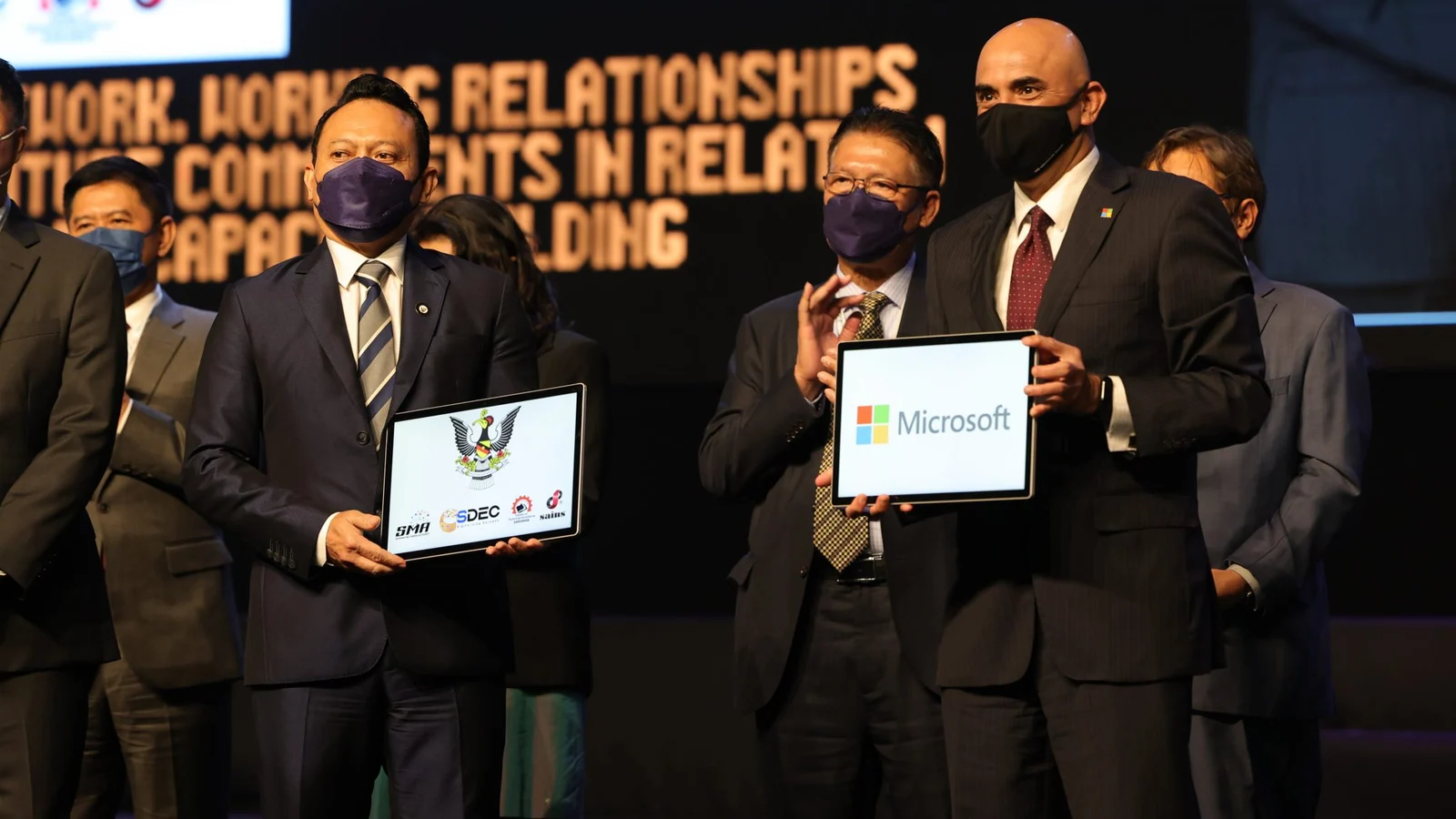 Sarawak and Microsoft representatives display their 2022 public-sector digital partnership agreement