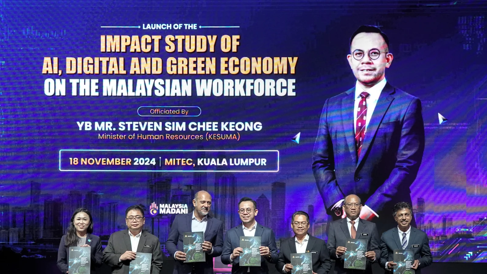 Malaysian ministers and TalentCorp leaders hold the workforce impact report at its launch in Kuala Lumpur