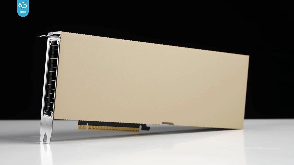 A gold-cased NVIDIA H100 data centre accelerator card standing upright on a reflective white surface against a black background