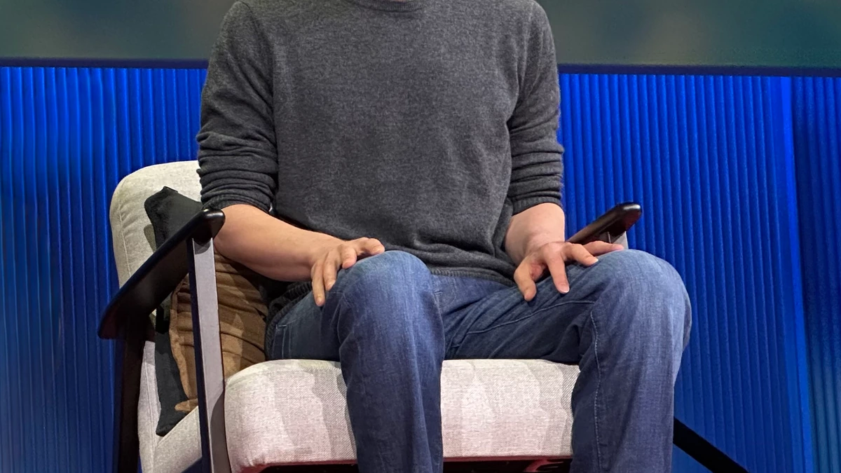 OpenAI chief executive Sam Altman sits on stage during a 2025 TED event