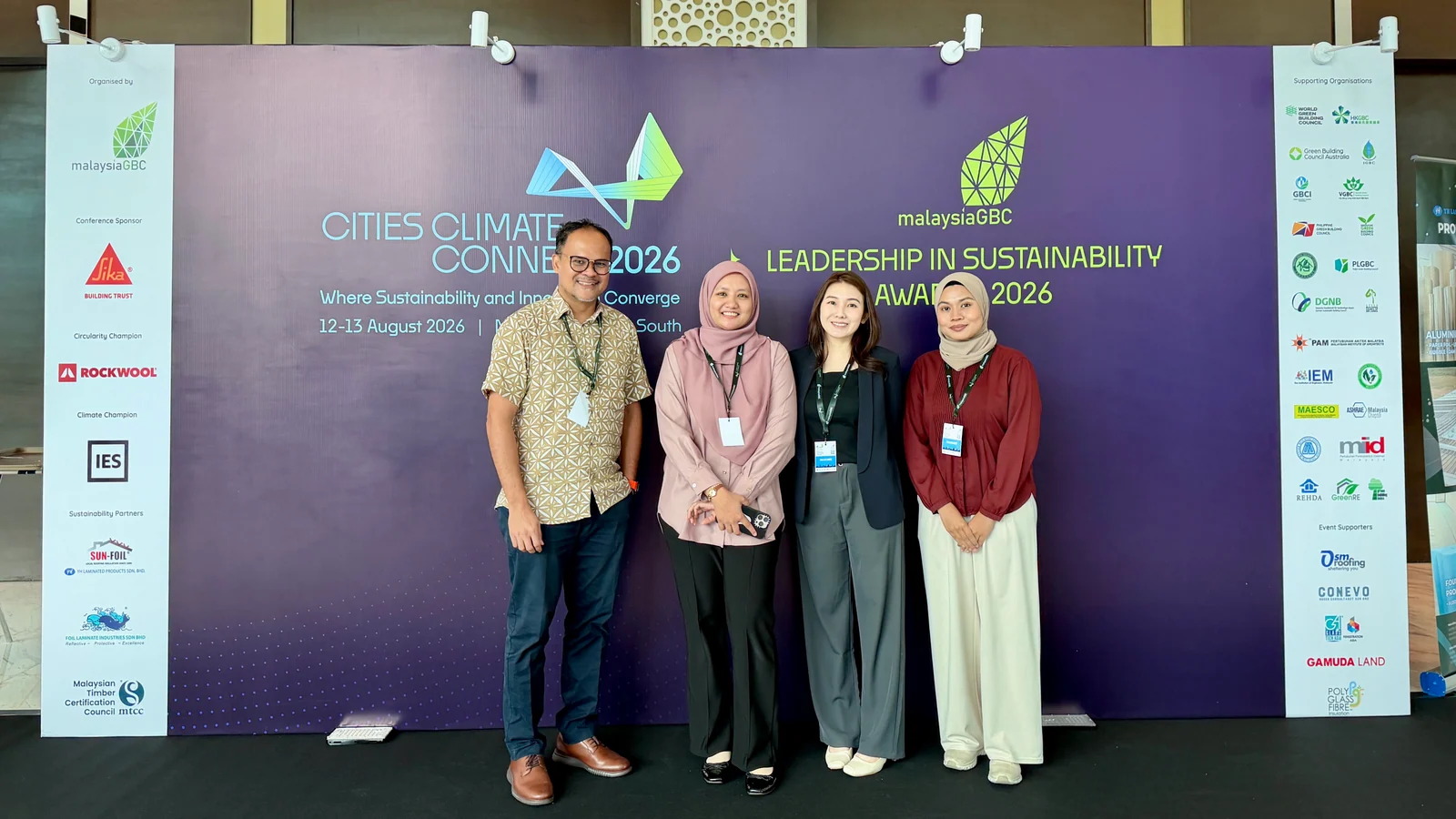 Four Future Cities Research Institute representatives stand in front of the Cities Climate Connect 2026 backdrop in Kuala Lumpur