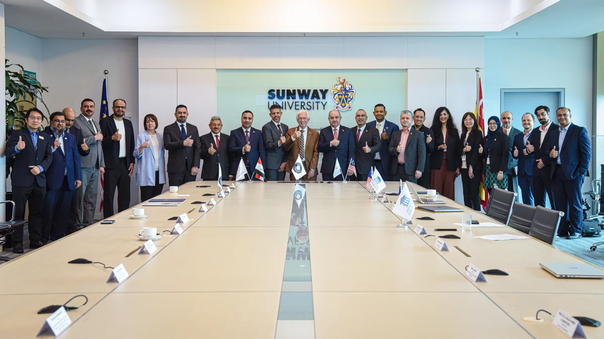 Sunway and Iraqi university representatives standing together after the collaboration launch
