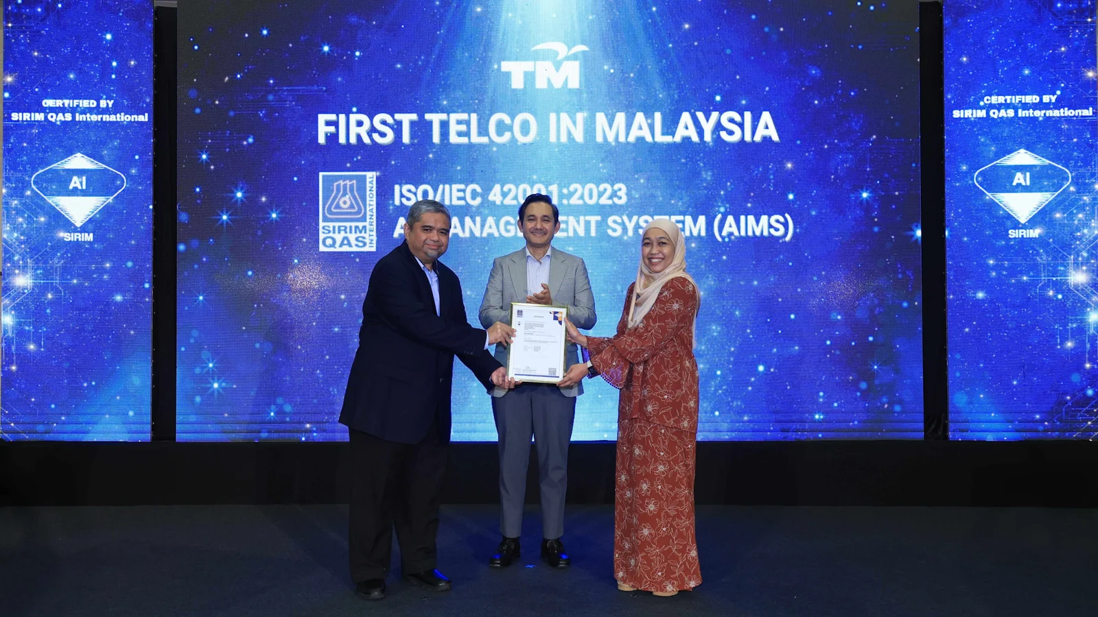 Telekom Malaysia representatives receive the ISO IEC 42001 artificial intelligence management certificate