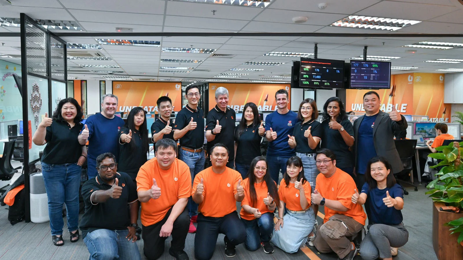 U Mobile and AWS personnel at the Malaysian contact centre used for the generative AI proof of concept