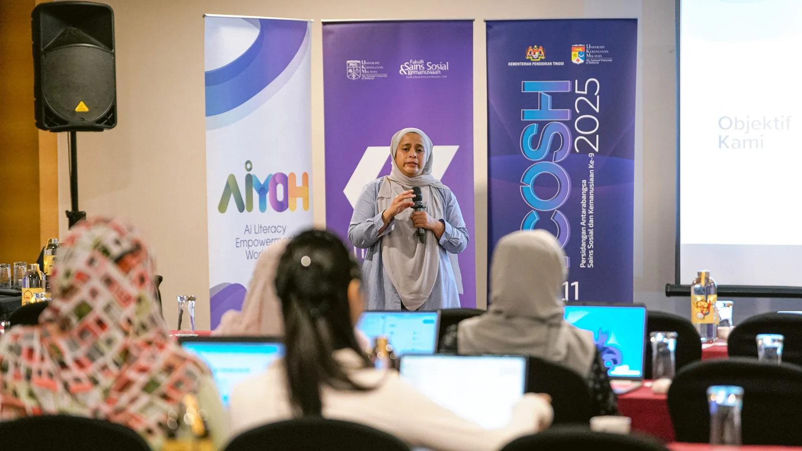 An AiYOH facilitator addresses participants at the later ICOSH 2025 workshop