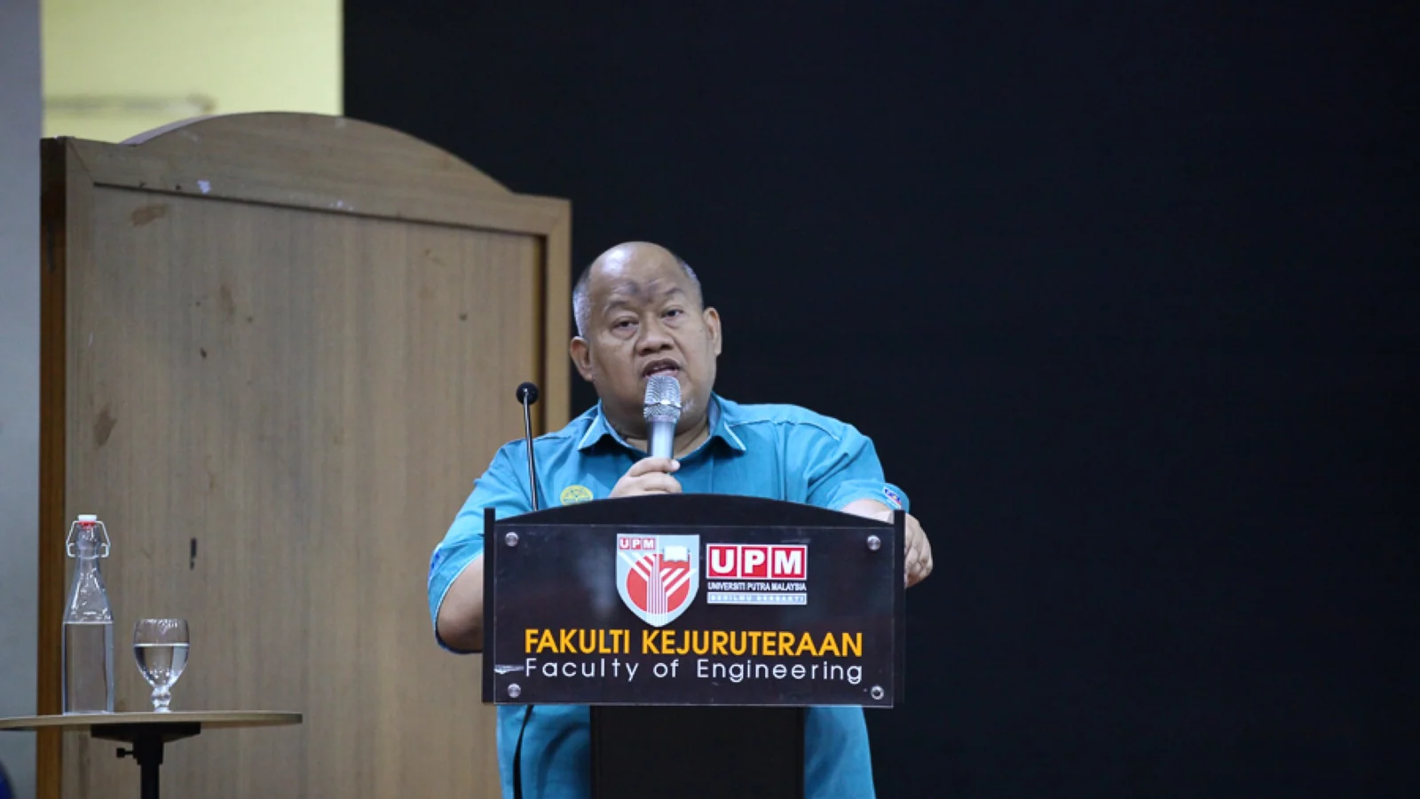 A speaker addresses the UPM Faculty of Engineering workplace-safety technology event
