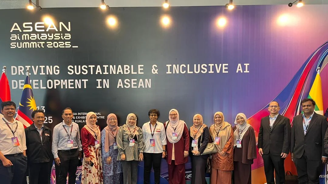 UPM participants stand at the ASEAN AI Malaysia Summit 2025 event backdrop in Kuala Lumpur