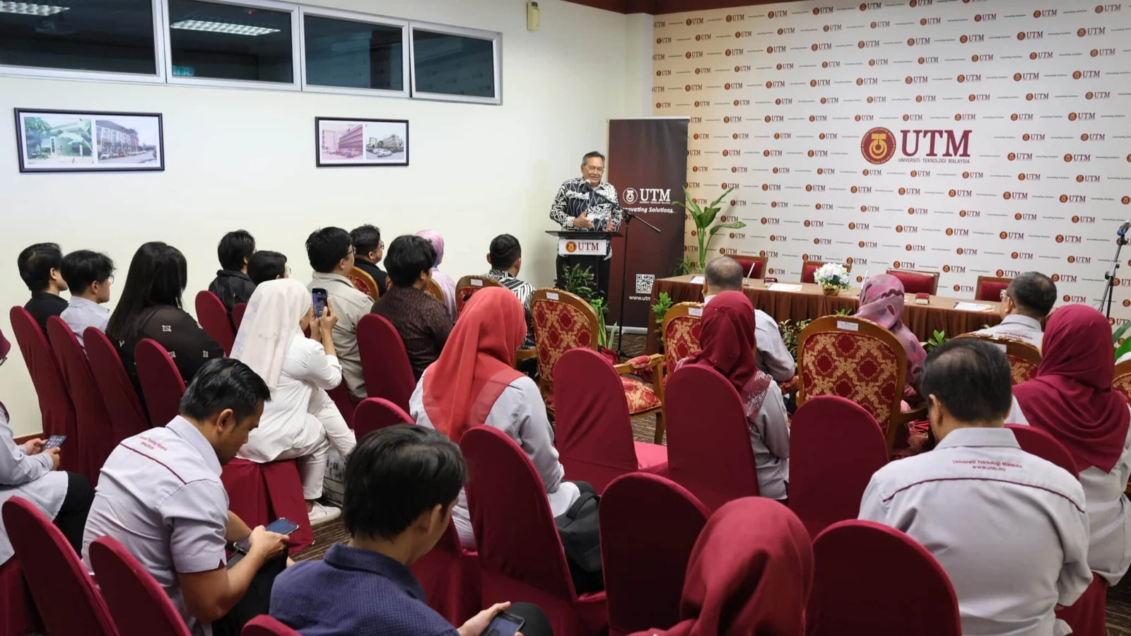 Guests attend UTM's signing ceremony with telecommunications company Pacton Technologies